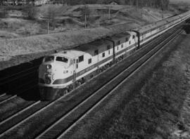 Great Northern diesel locomotive 504 leads a passenger train.  Other subject categories:  Passenger