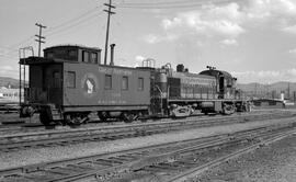 Great Northern Caboose X629 and Diesel Locomotive 200 at Wenatchee, Washington, undated