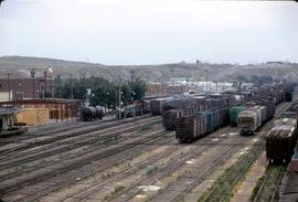 Great Northern Railway yard scene at Havre, Montana, with Train 32, Empire Builder, stopped at st...