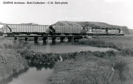 Burlington Northern Diesel locomotives 1527 and 1597 at Milepost 75.4 on the Scobey Line, Montana...