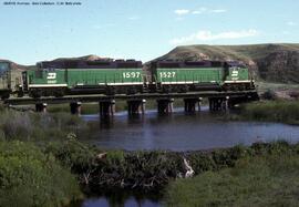 Burlington Northern Diesel locomotives 1527 and 1597 at Milepost 75.4 on the Scobey Line, Montana...