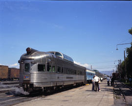 An Amtrak dome observation car gets a wiindow wash at Livingston, Montana on September 2, 1972.