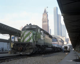 Burlington Northern diesel locomotive 7055 assists train number 7 at Seattle, Washington, on Dece...