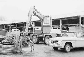 Log loader in Aloha, Washington, January 1975.