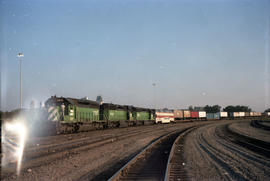 Burlington Northern Railroad trailer on flat car train 121 at Kansas City, Missouri, on August 1,...