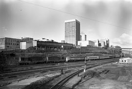 Two freight locomotives assist Amtrak diesel locomotives at Tacoma, Washington on January 2, 1972.