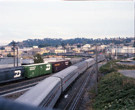 Burlington Northern diesel locomotive 2520 assist Amtrak power northbound away from Tacoma, Washi...