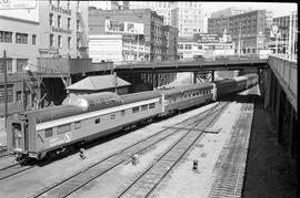 Amtrak passenger train number 792 leaves King Street Statioon at Seattle, Washington in August 1974