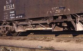 The unloading gate detail of Northern Pacific Hart ballast car 87384 at Denver, Colorado, in 1973.