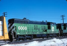 Burlington Northern Diesel Locomotive Number 6000 Follows another Burlington Northern Diesel at B...