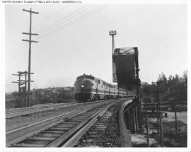 Great Northern Diesel Locomotive 504 leading a Passenger Train at Interbay, Washington in 1947.