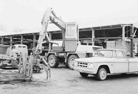 Log loader in Aloha, Washington, January 1975.