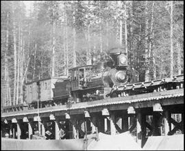 Northern Pacific steam locomotive at Stampede Pass, Washington Territory, 1887.